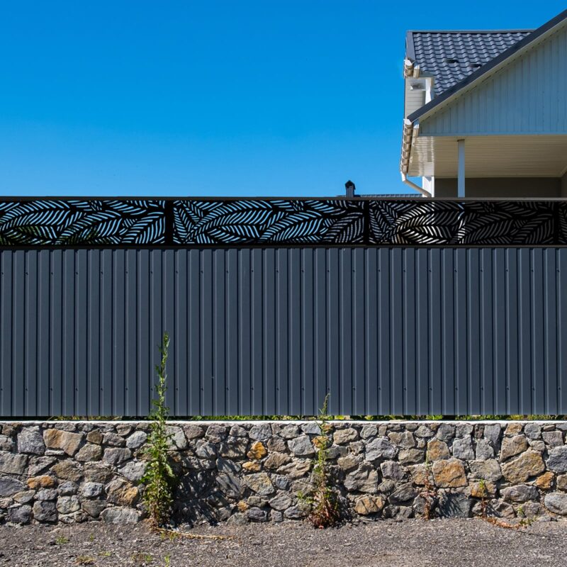 Grey metal corrugated fence in Jack Matrix Fence Extension Ferns 1810x450mm Charcoal