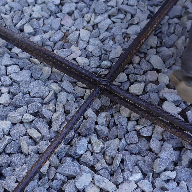 Roll of 110mm black annealed rod ties in bulk, suitable for fastening mesh or reinforcing bars in backyard projects.